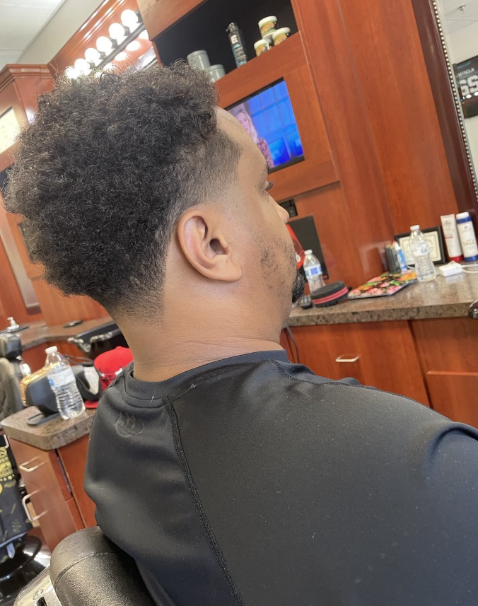 man getting hair cut
