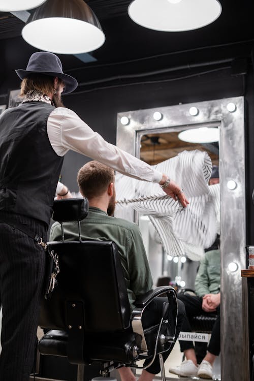 man in barbers chair with barber