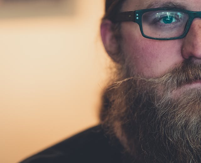 man with beard and glasses